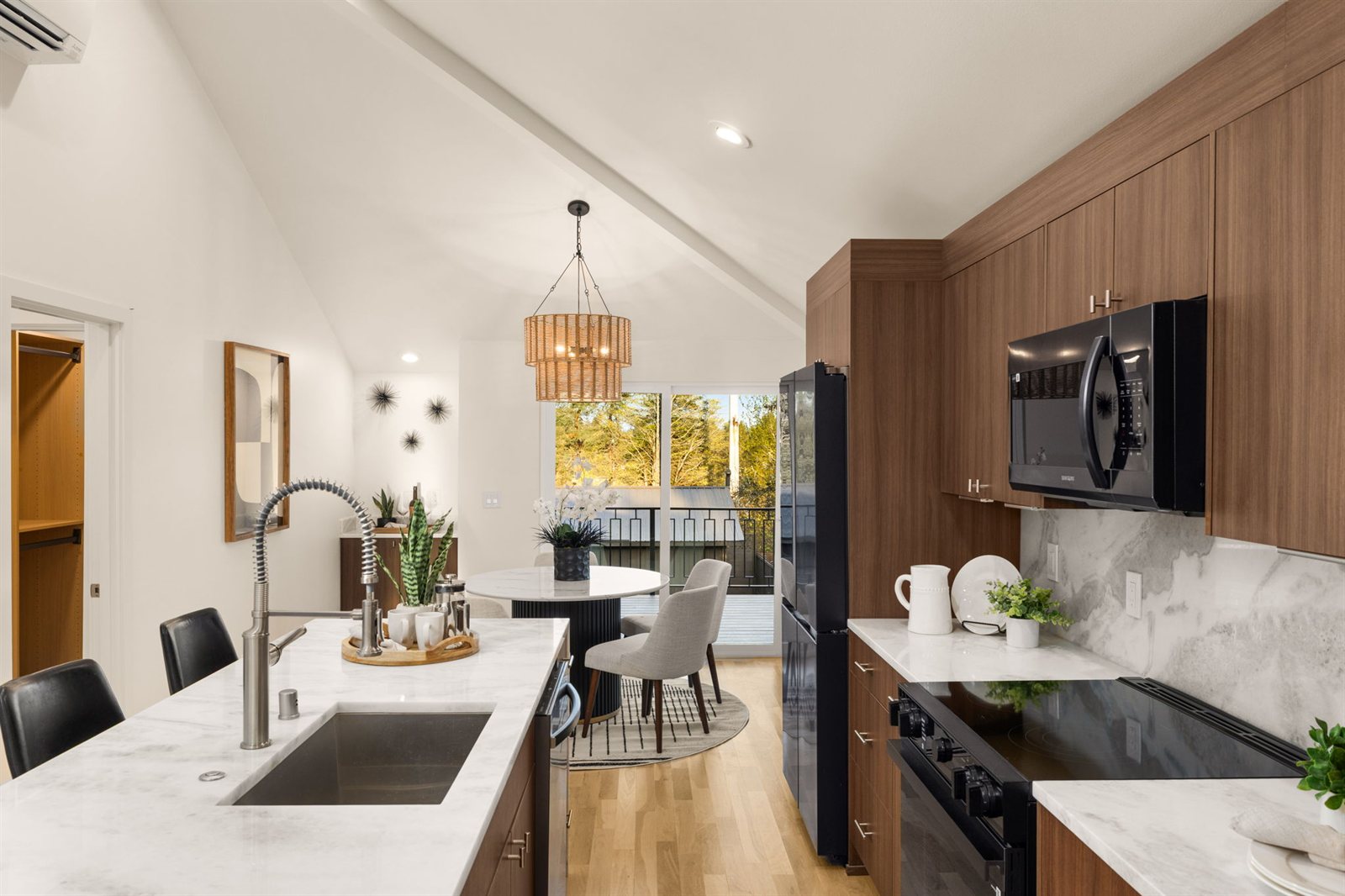 Premium HD listing photograph from a recent VWP listing — a walnut-and-marble kitchen